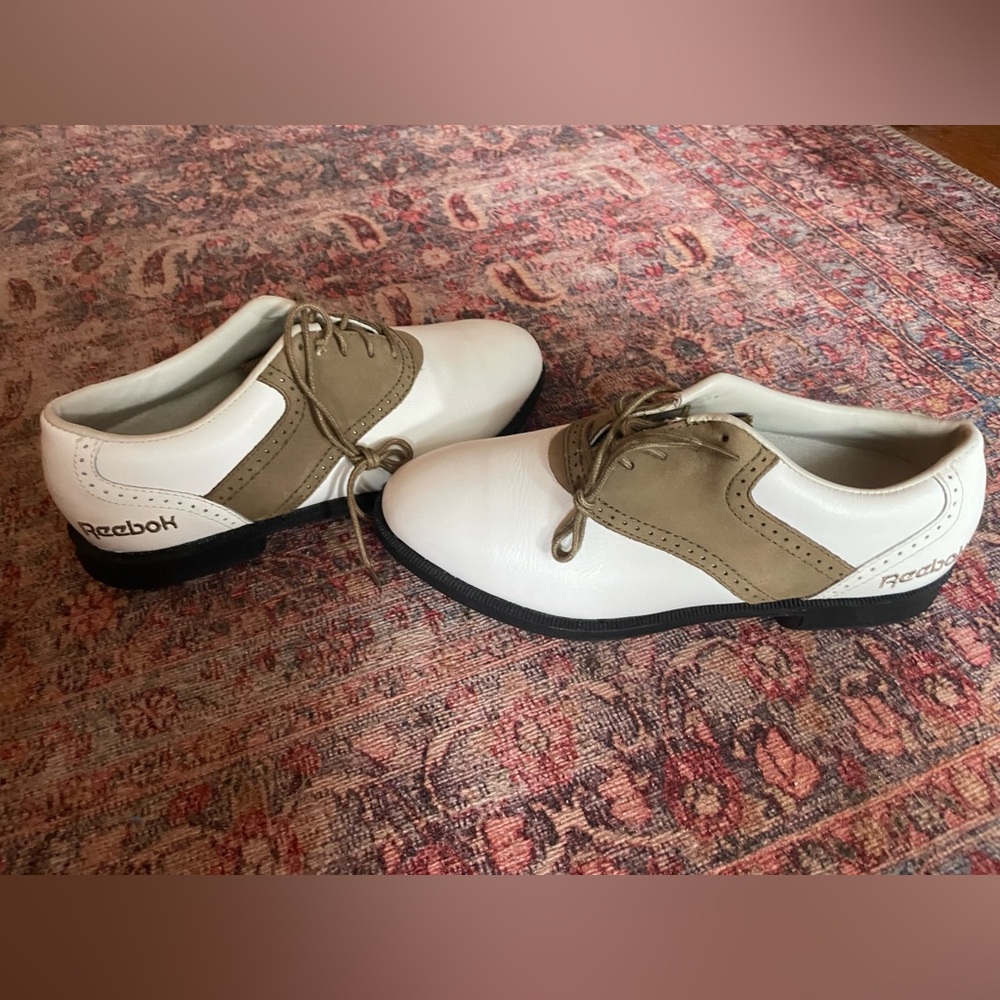Ladies size 5 Reebok gold shoes.